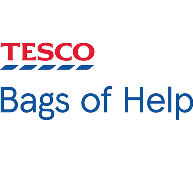 Red Tesco logo with broken blue line beneath and the words Bags of Help written in blue below