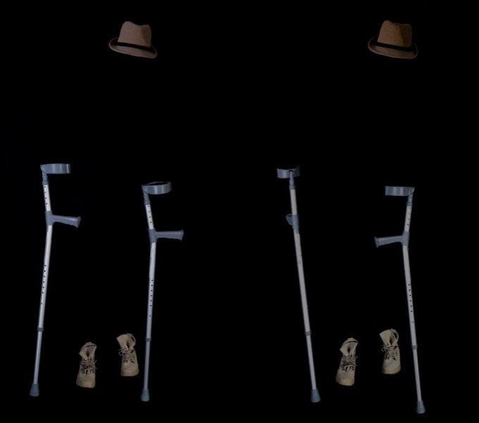 A black background with what appears to be two floating hats , a pair of crutches and two pairs of shoes, the person remains invisible.
